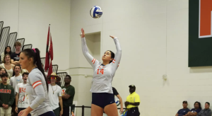 Maeva serves the ball in a match against Miami