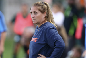 Thrasher Adams watches her team during a match